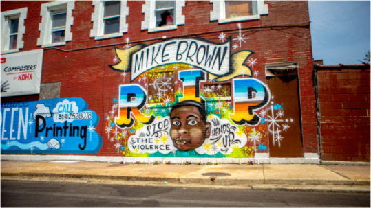 A mural in memoriam of Mike Brown, an unarmed black teenager shot by police in Ferguson, Missouri was painted on the side of a business in North St. Louis. The tribute was done by artist Joseph Albanese and commissioned by Signature Screenprinting according to the St. Louis Dispatch. It’s a “dedication to the Mike Brown tragedy and awareness of injustice in our communities,” wrote the custom t-shirt maker on its Facebook page. Funeral services for Brown will be held at the Friendly Temple Missionary Baptist Church on Monday. (Photo: Aymann Ismail/ANIMALNewYork) http://iamturbo.com/wp-content/uploads/2014/08/ferguson-mike-brown-mural_-600x3371.jpg