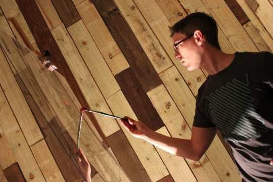 Christenbery working on a live painting on plexiglass. (photo courtesy Brooklyn Nicole)