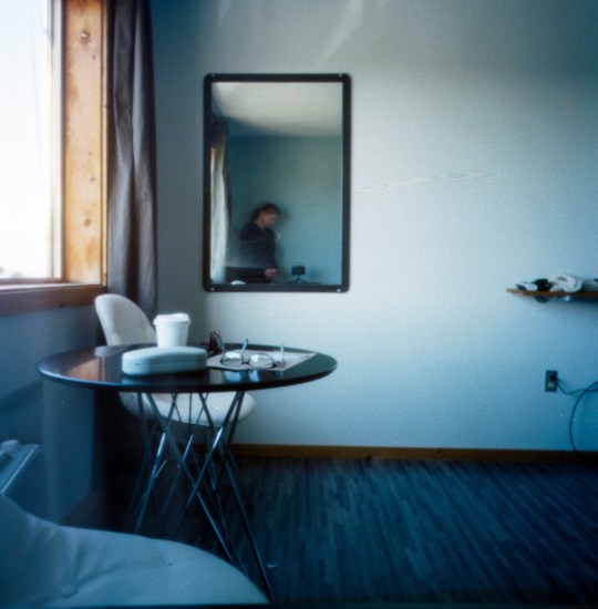 Self Portrait In a Hotel Room Mirror