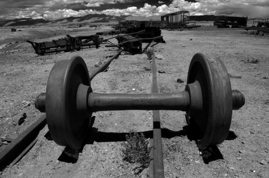 Derailed train axle at Uyuni's train cemetery, Bolivia.
