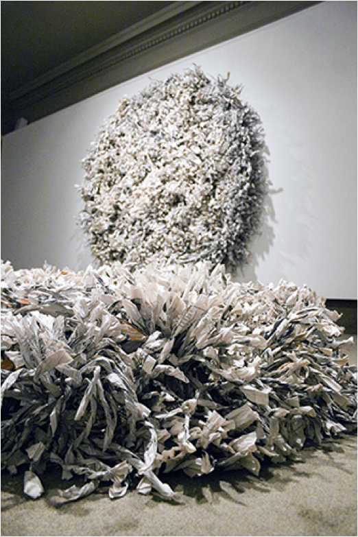 “Wrenching News,” 2010. Shredded, twisted, and wrapped newspapers (New York Times). Wall: 7′ x 7′ x 1′. Floor: 6′ x 6′ x 1′. http://museum.spelman.edu/wp-content/uploads/2013/07/LIVES20_0.jpg